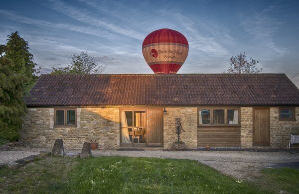 Front of Whitley Coach House with a ballon having just gone over